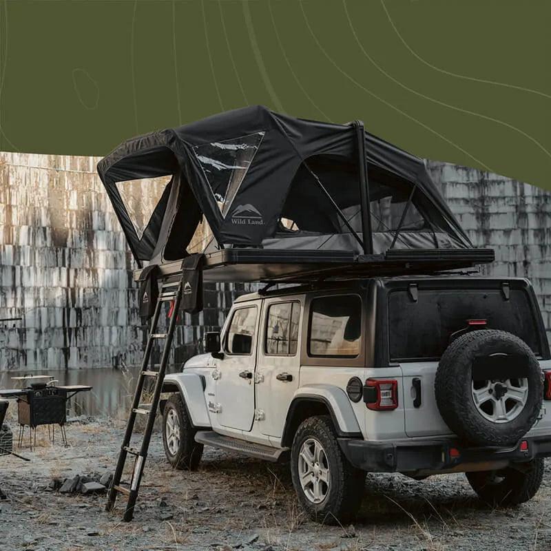 Wild Land OrthFrame Max roof top tent mounted on vehicle, featuring durable fabric, ladder, and window for outdoor camping adventures.