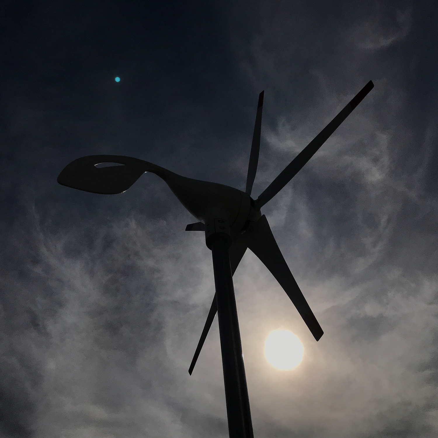 Nature's Generator 150W wind turbine for renewable energy, showing the turbine's blades and mounting structure.