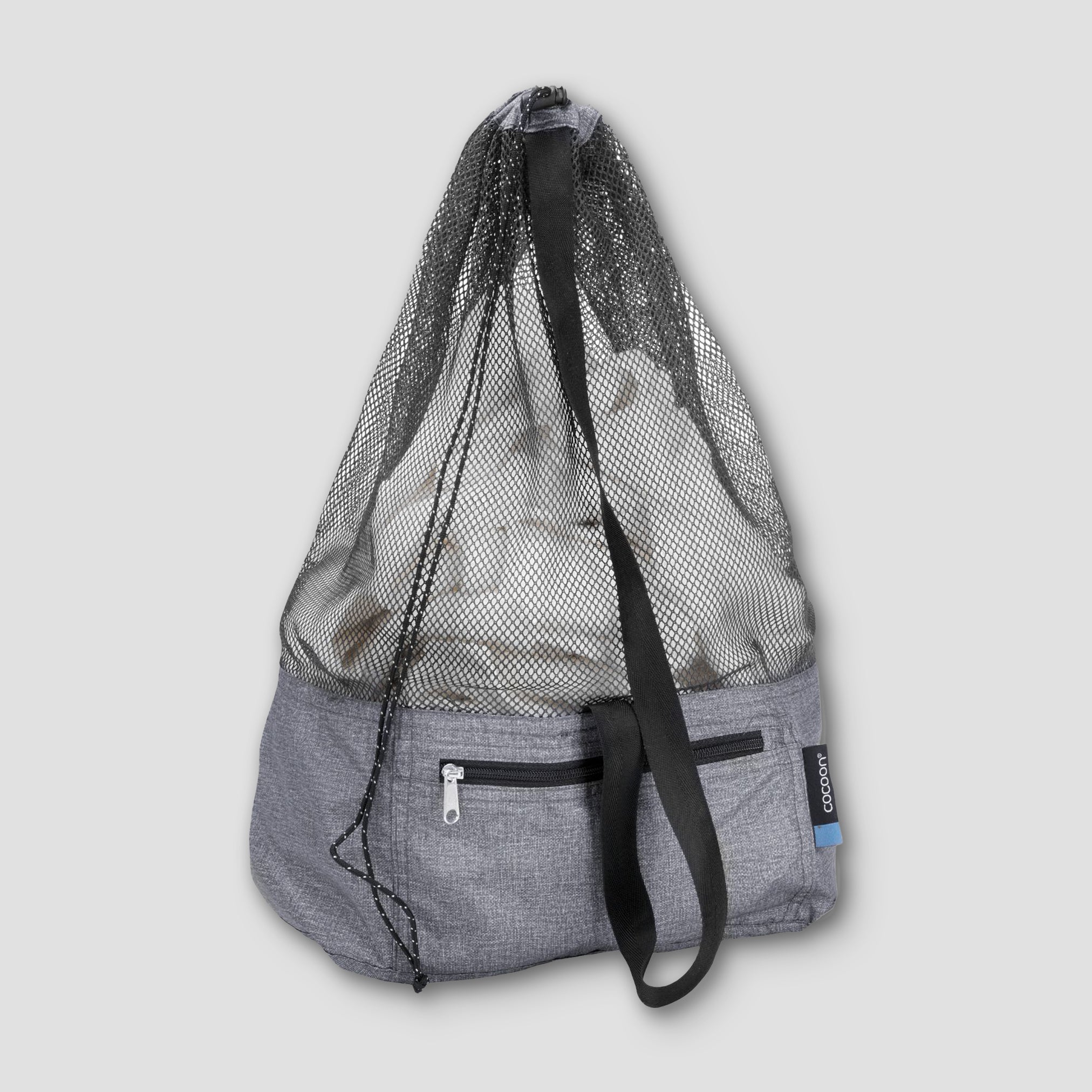 COCOON traveler and city laundry bag in black with durable fabric and handle for easy carrying during trips and daily use.