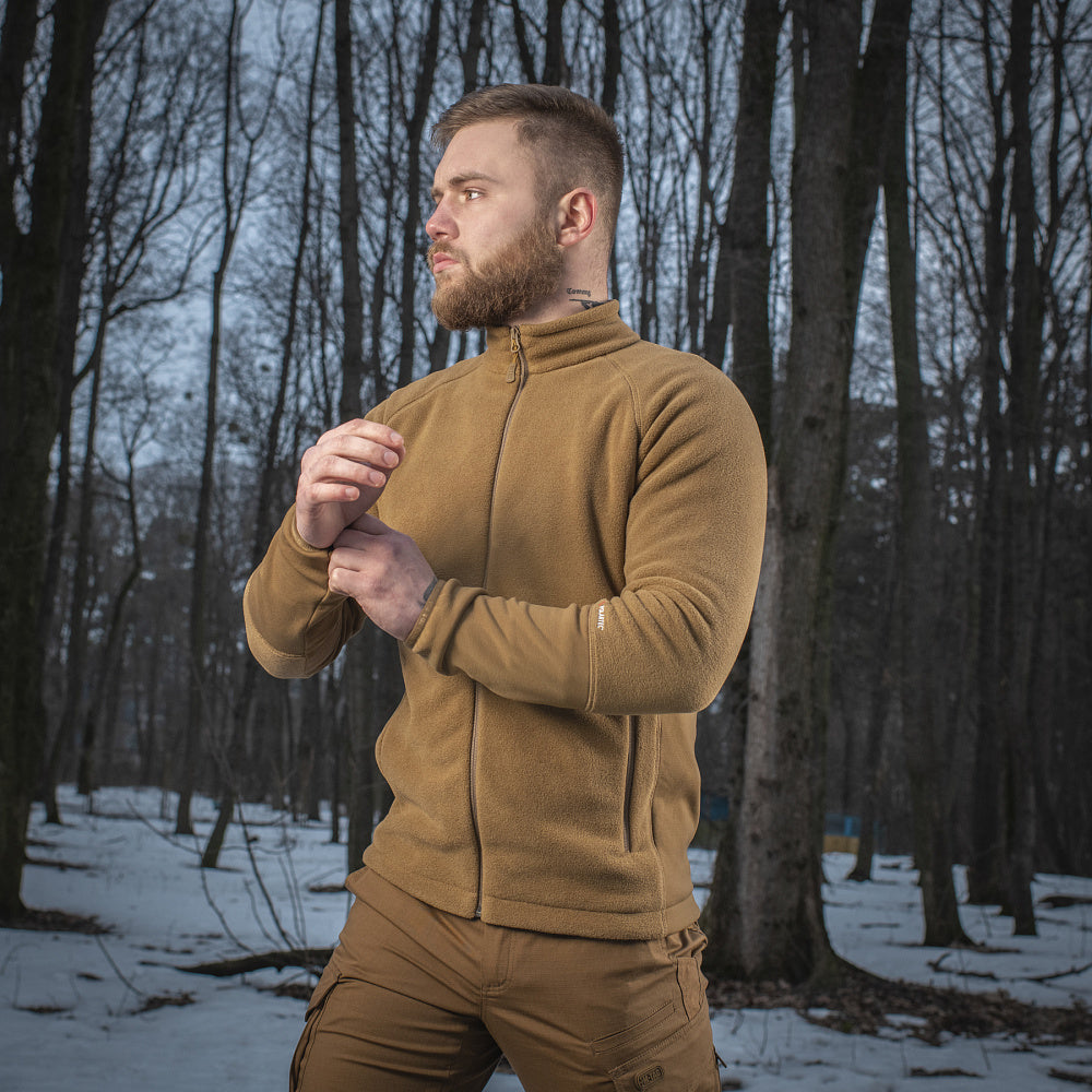 M-TAC Fleece Jacket in Polartec fabric, showcasing a comfortable fit and versatile outdoor design in a natural setting.