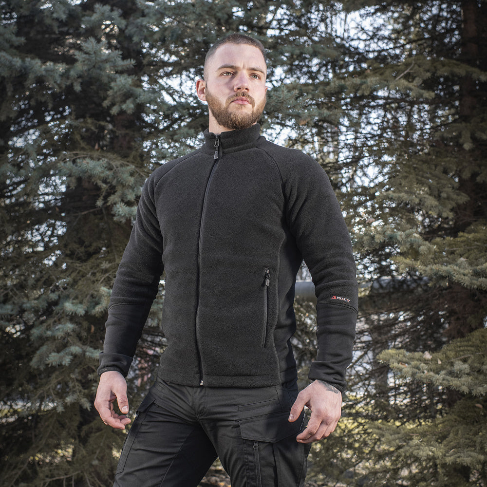 M-TAC Polartec fleece jacket in dark color, showcasing a zip closure and practical pockets for outdoor activities.