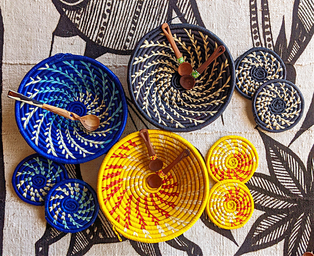 Large blue and white woven African basket by Reflektion Design, featuring intricate patterns and vibrant colors.