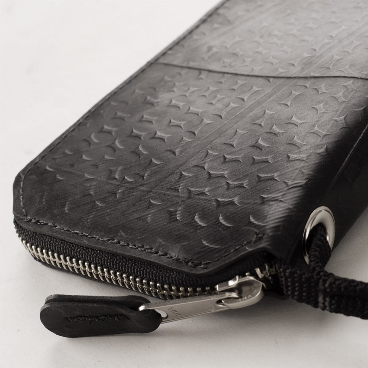 Grey Alchemy Goods Fauntleroy Clutch wallet by ZEITBIKE with zipper closure, made of durable material, shown open with interior compartments.