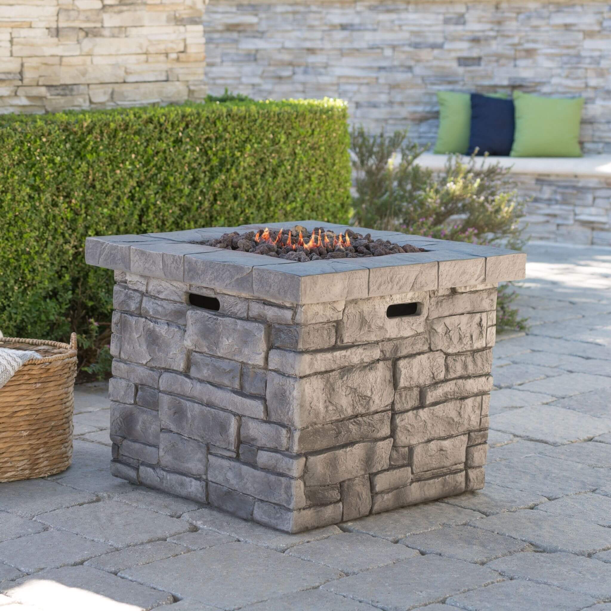 Alora 30-inch modern outdoor fire table with steel frame and lava rocks, designed for propane use.