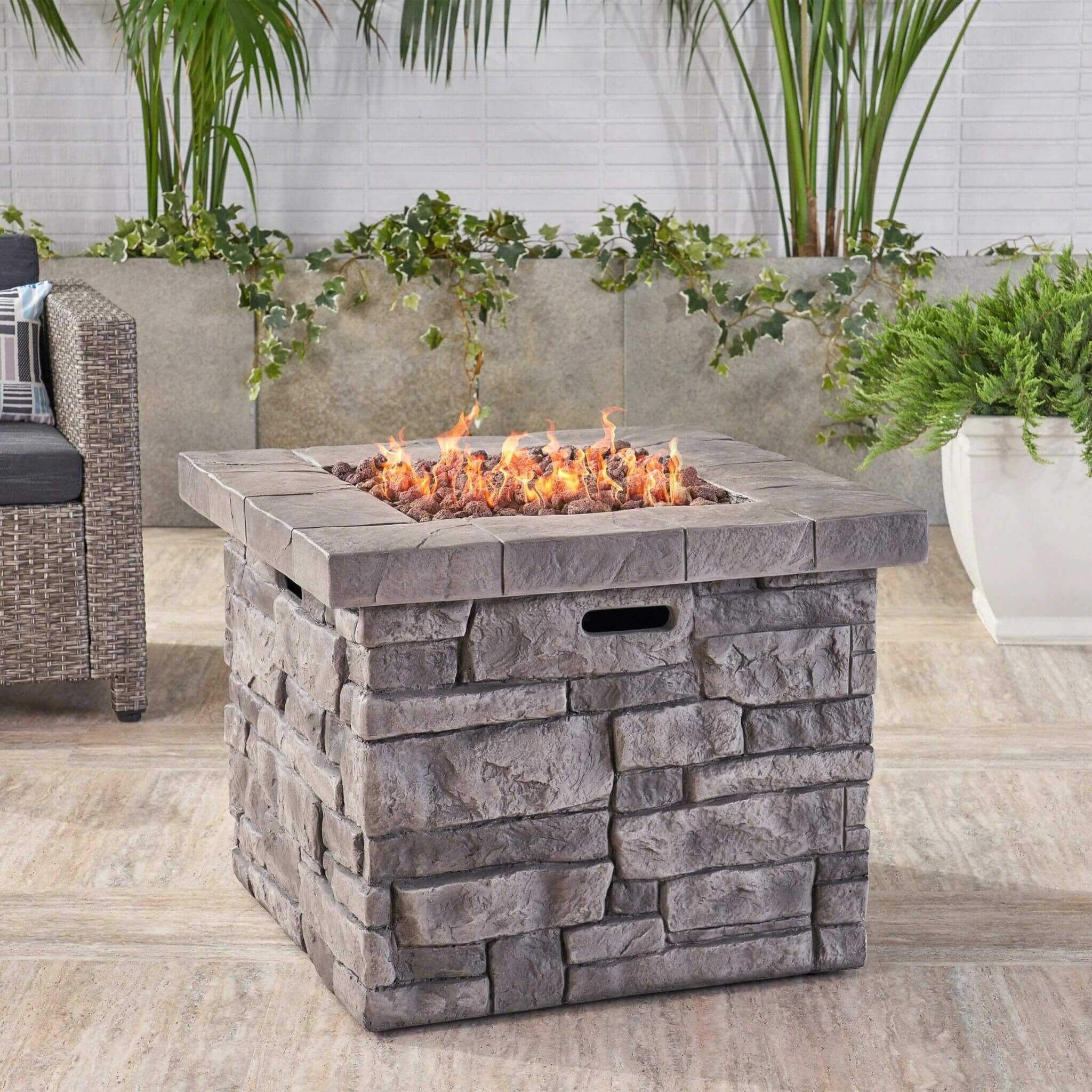 Alora 30-inch modern propane fire table with steel frame and lava rocks, perfect for outdoor gatherings.