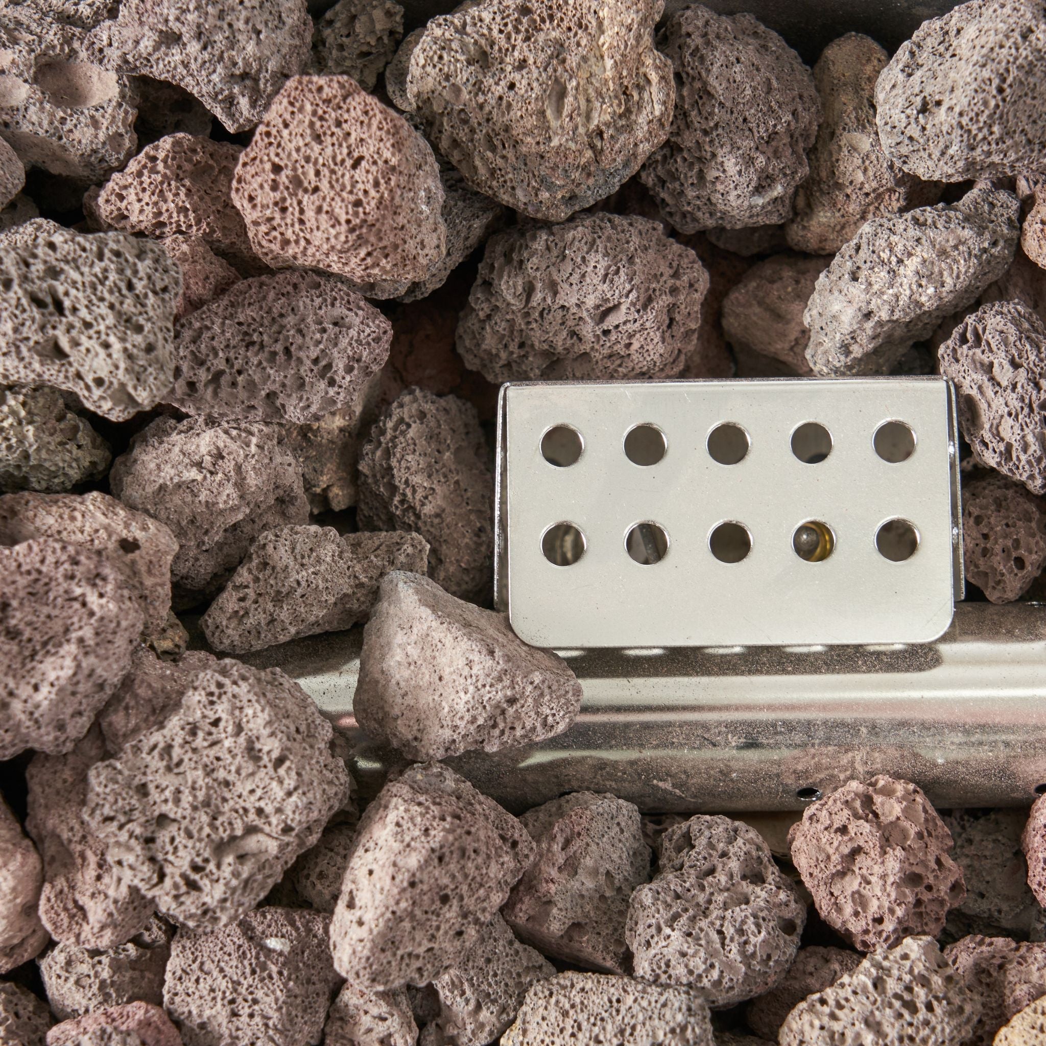 Alora Premium outdoor rectangular propane gas fire pit table with rock details, 40K BTU, by SAKSBY WHOLESALE.