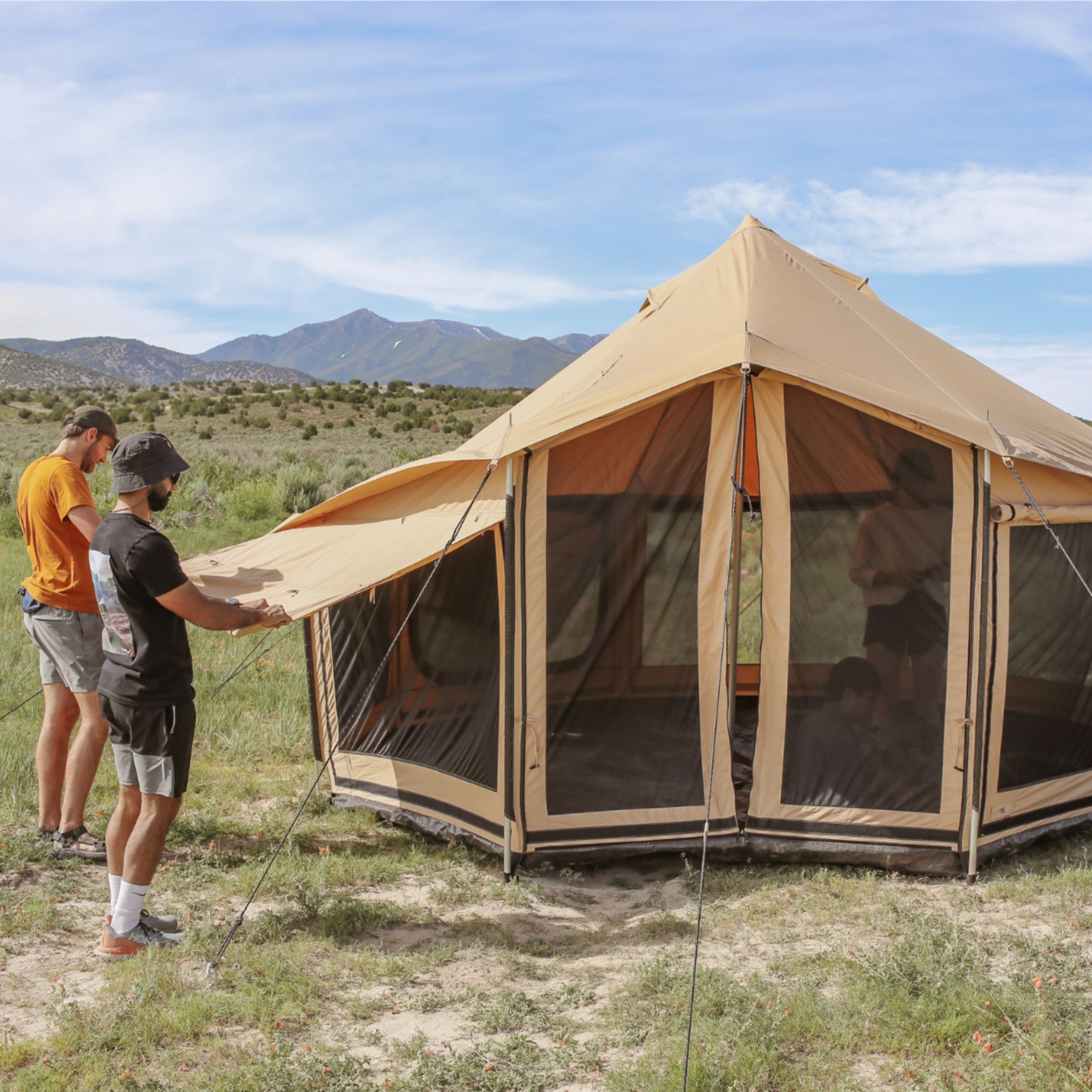 White Duck Outdoors Altimus Bell Tent with built-in awning, open to show spacious interior and durable fabric for camping adventures.