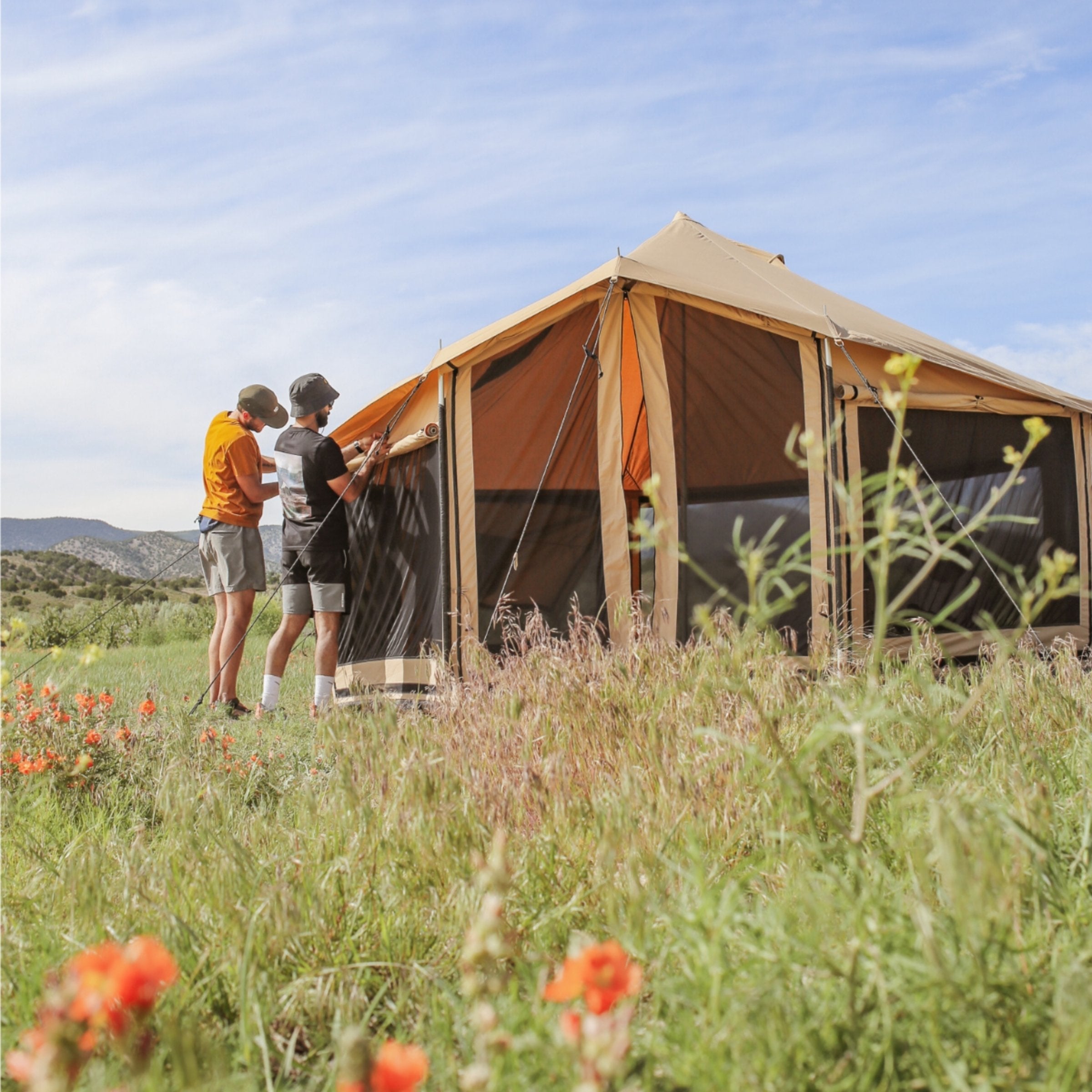 White Duck Outdoors Altimus Bell Tent with rolled window flaps, showcasing durable canvas and spacious design.