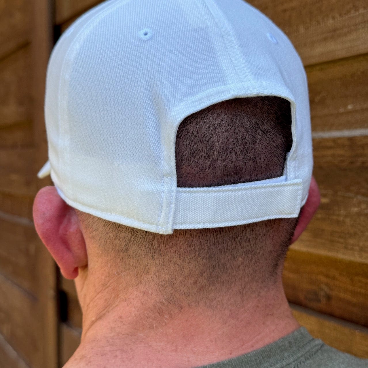 Black SFT2 Tactical minimalist cap with curved brim and adjustable strap, featuring sleek, simple design for casual wear.