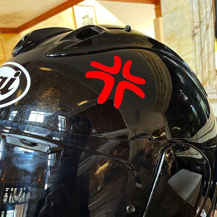 Hand-painted style attitude helmet sticker by Bean's Moto Booth on a motorcycle helmet, featuring bold, colorful graphic design.