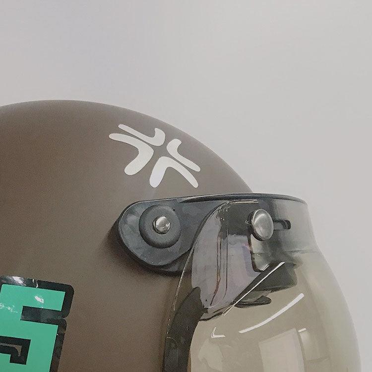Hand-painted style Attitude Helmet Sticker by Bean's Moto Booth on a motorcycle helmet, featuring bold, colorful graphic design.