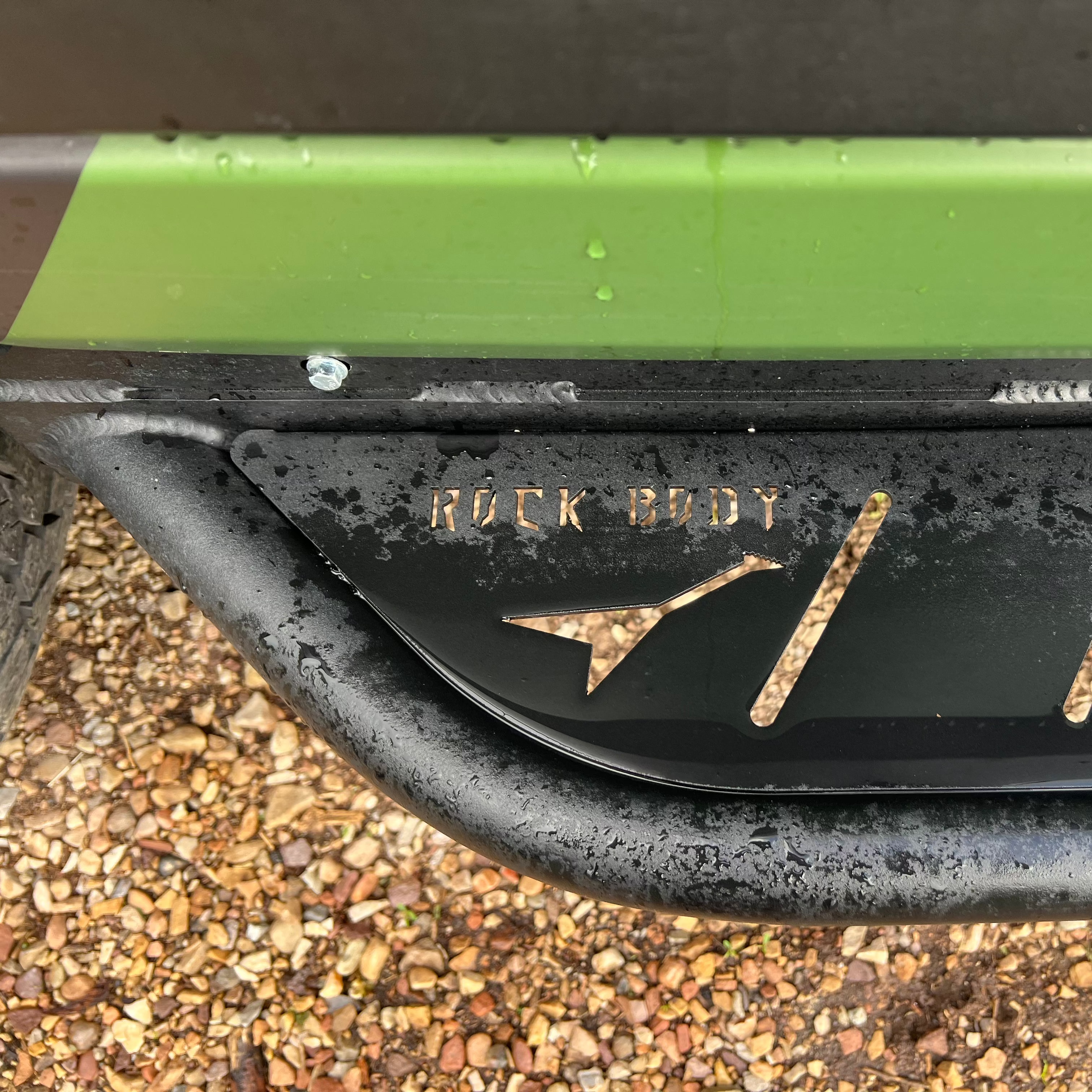 Avatar Offroad Ford Transit Rockbody Side Steps installed on van, showing durable, textured metal design for easy vehicle entry.