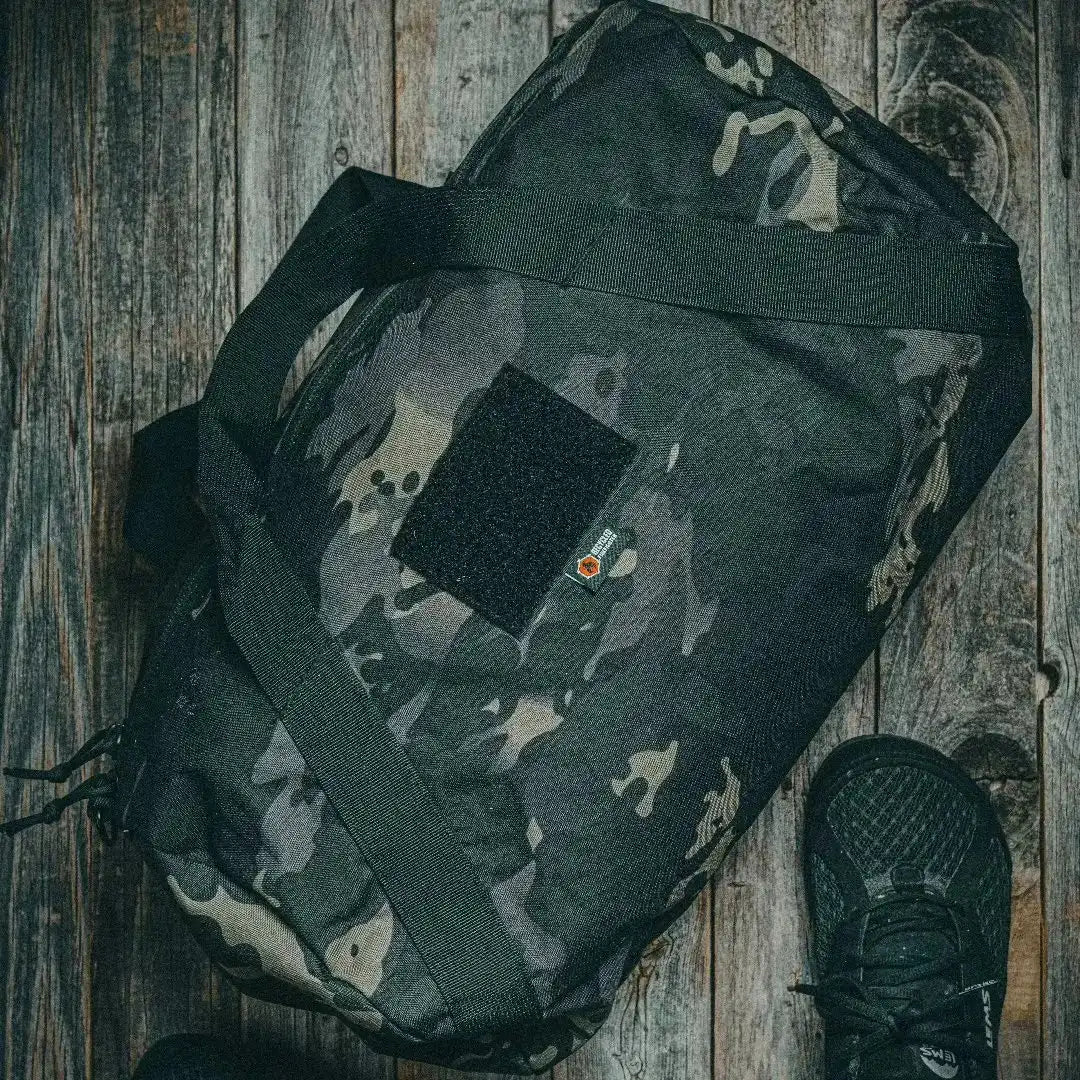 Recycled Firefighter Barrel Duffle Bag 1000D, black backpack with sturdy handles and durable military-style design.