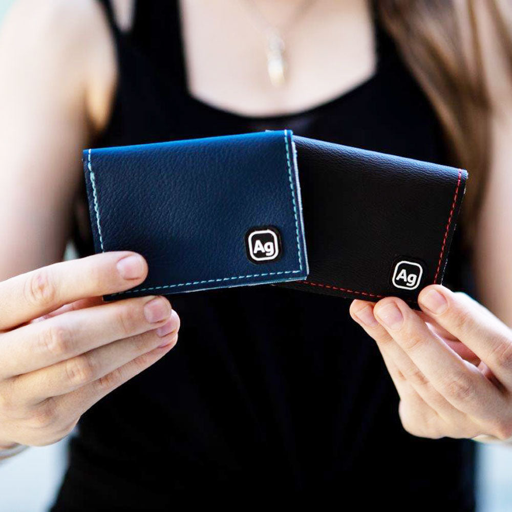 ZEITBIKE Alchemy Goods Belltown Wallet with vinyl upholstery held in hands, showcasing compact, durable wallet design.