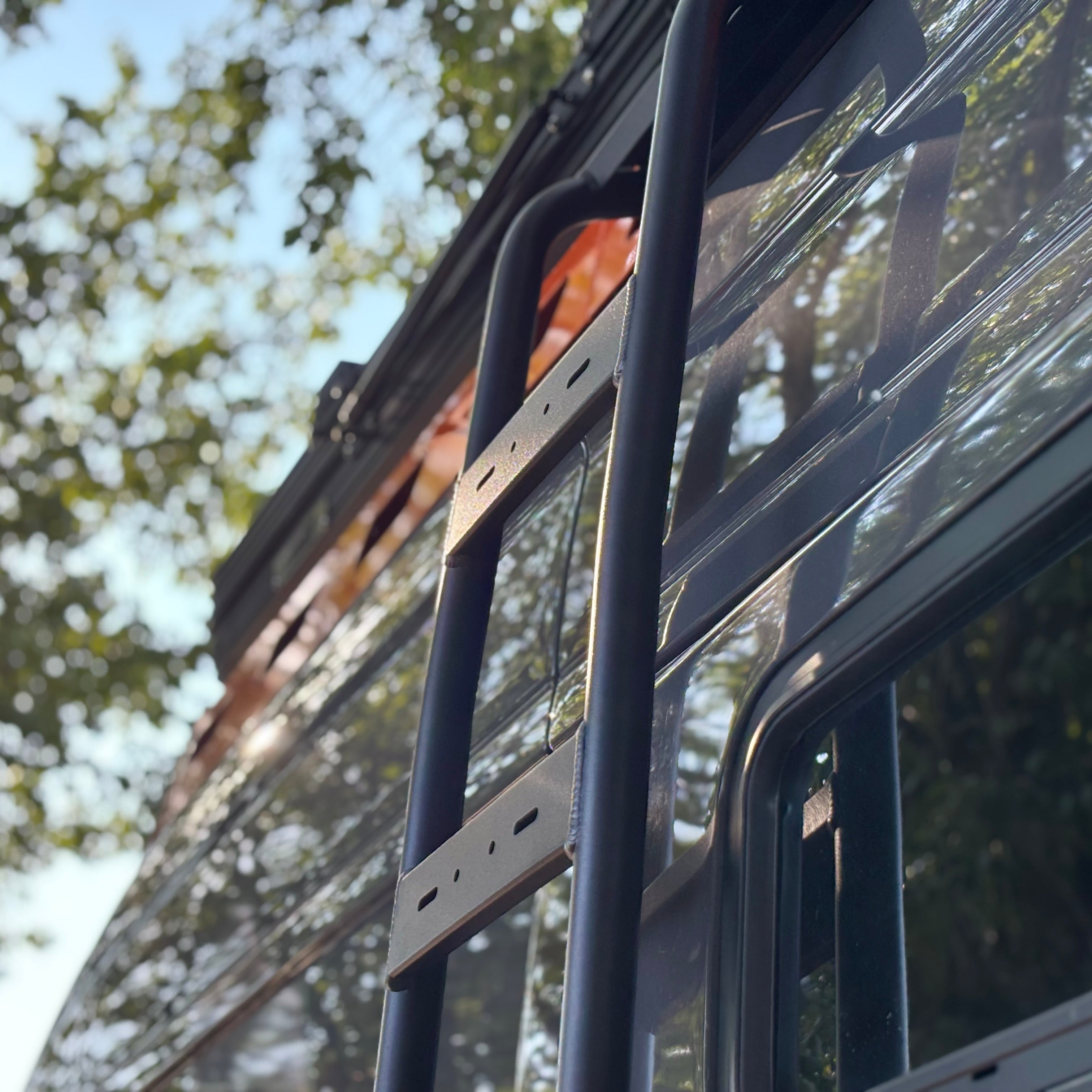 Mercedes Sprinter Van side ladder by Avatar Offroad, sturdy aluminum ladder mounted on the side of the van for easy access.