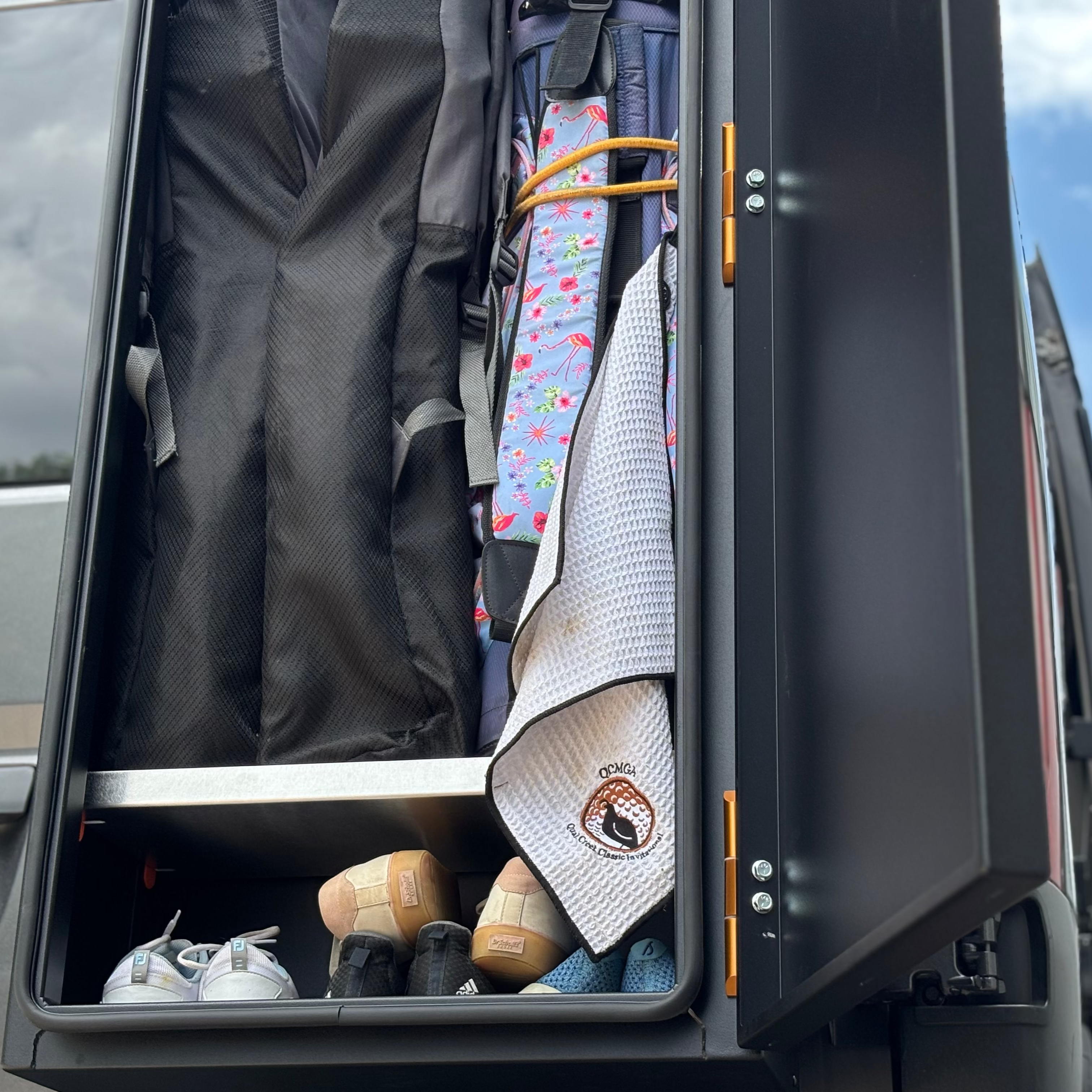 Avatar Offroad golf storage box with organized compartments, designed for safe and convenient golf club and accessory storage.
