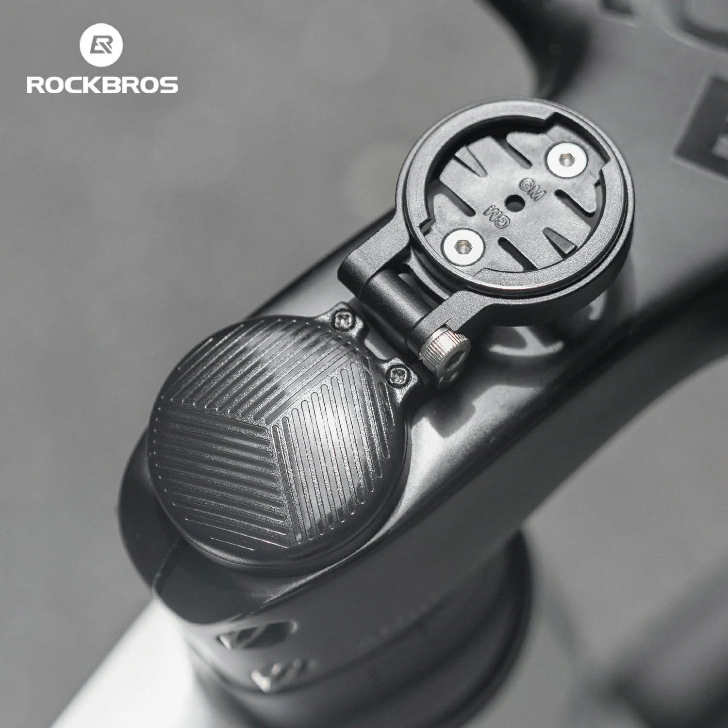 Adjustable ROCKBROS-US bike computer mount for headset cap with secure grip and easy installation on bicycle handlebars.