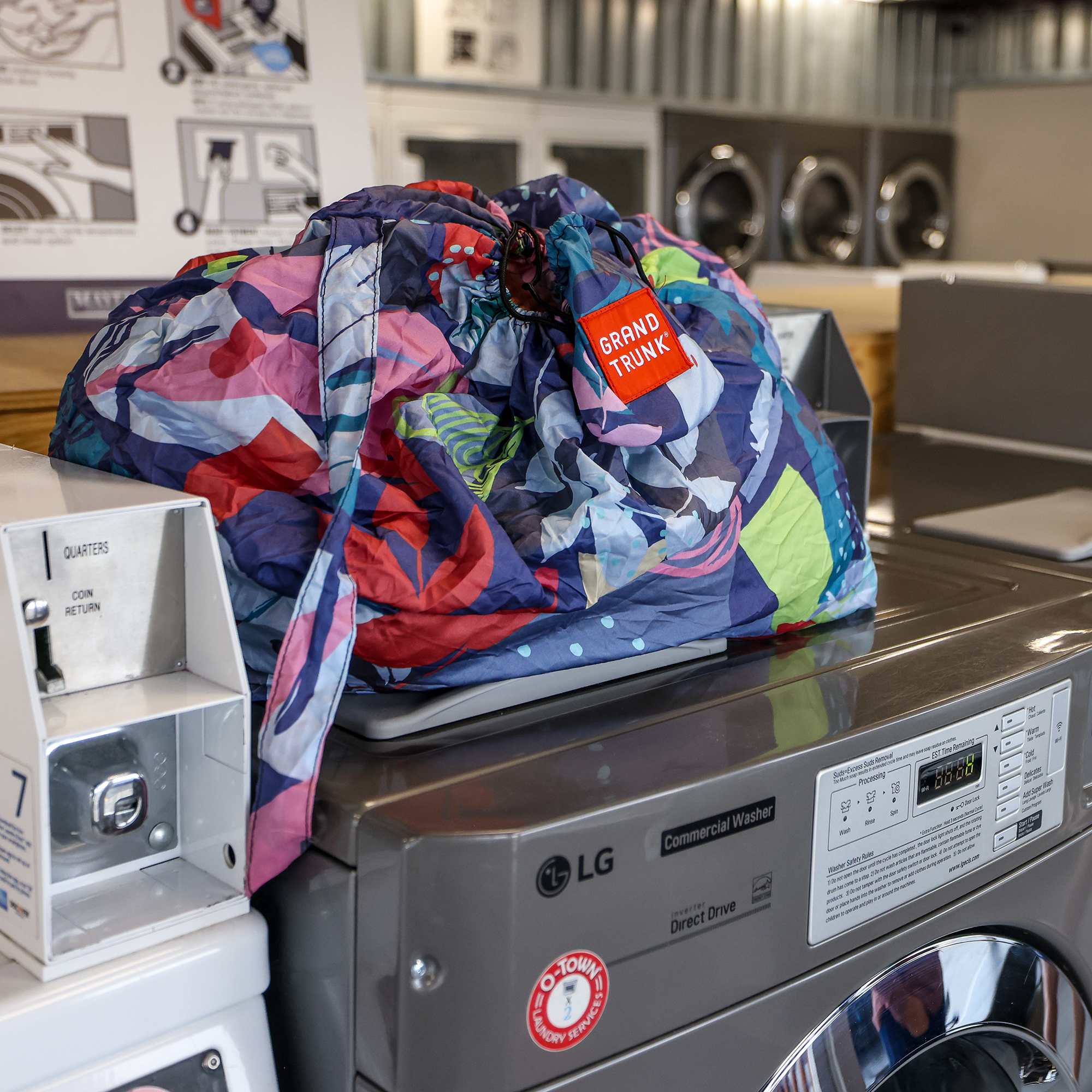 GrandTrunk Bindle travel laundry and storage tote with handle, durable fabric, and secure closure for organizing clothes on the go.