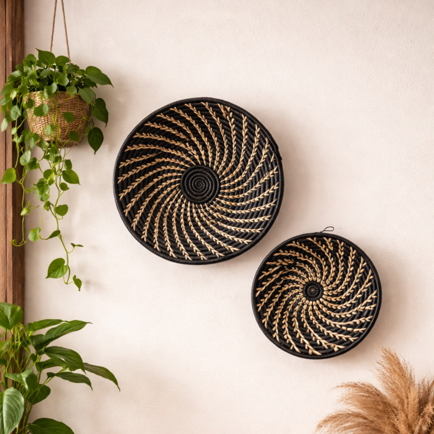 Large black and white woven African basket by Reflektion Design displayed on a wall, showcasing intricate patterns and craftsmanship.