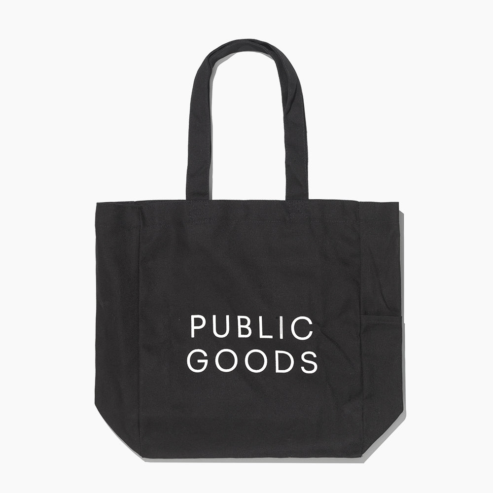 Black organic cotton canvas tote bag by Public Goods, showcasing a spacious and durable household accessory with natural texture.