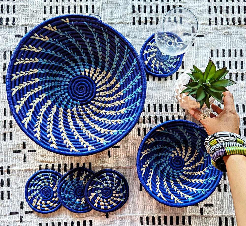 Large blue and white woven African basket by Reflektion Design, showcasing intricate patterns and craftsmanship.