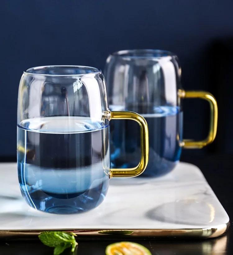 Blue ombre glass pitcher and cups set by Tea + Linen, showcasing elegant gradient colors and stylish design.