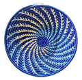 Large woven African basket in blue and white with intricate patterns, crafted by Reflektion Design.