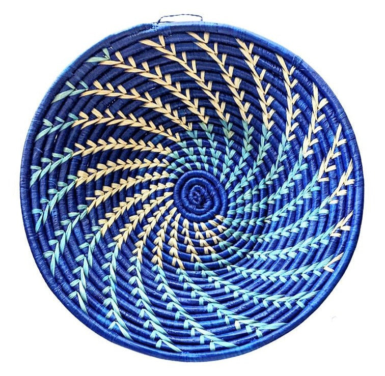 Large woven African basket in blue and white with intricate patterns, crafted by Reflektion Design.