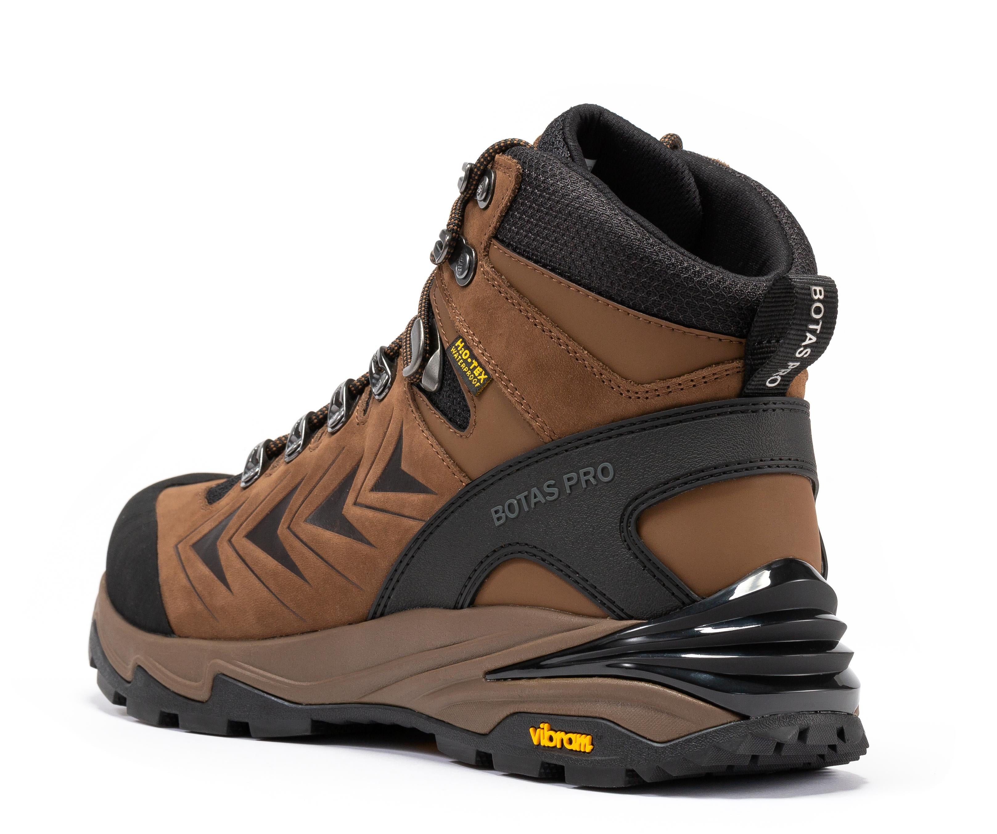 Brown Pro hiking boots by Rock Rooster Footwear Inc featuring waterproof design and VIBRAM® traction lug outsole, 6-inch height.