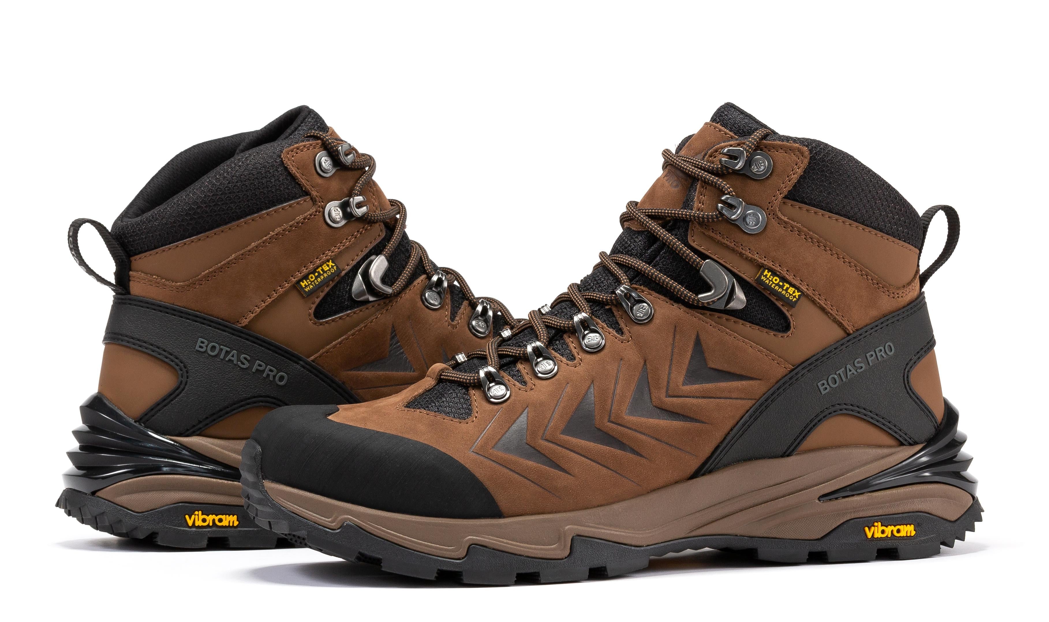 Brown waterproof hiking boots by Rock Rooster Footwear Inc with VIBRAM® traction lug outsole, 6-inch ankle height.