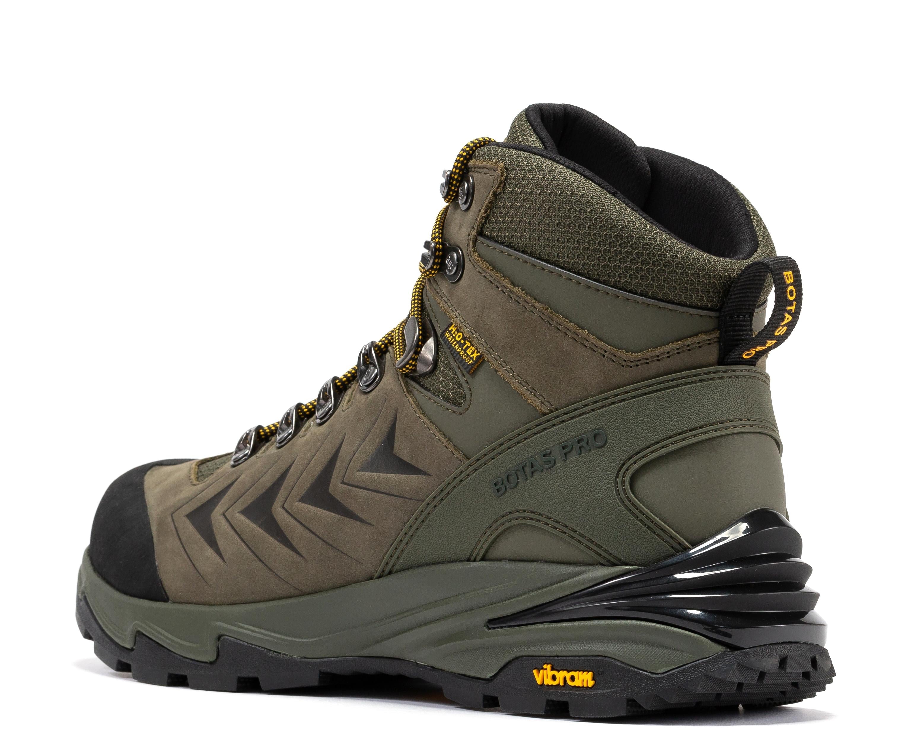 Rock Rooster Pro Olive 6 Inch Waterproof Hiking Boots with VIBRAM® Traction Lug outsole on rugged outdoor terrain.