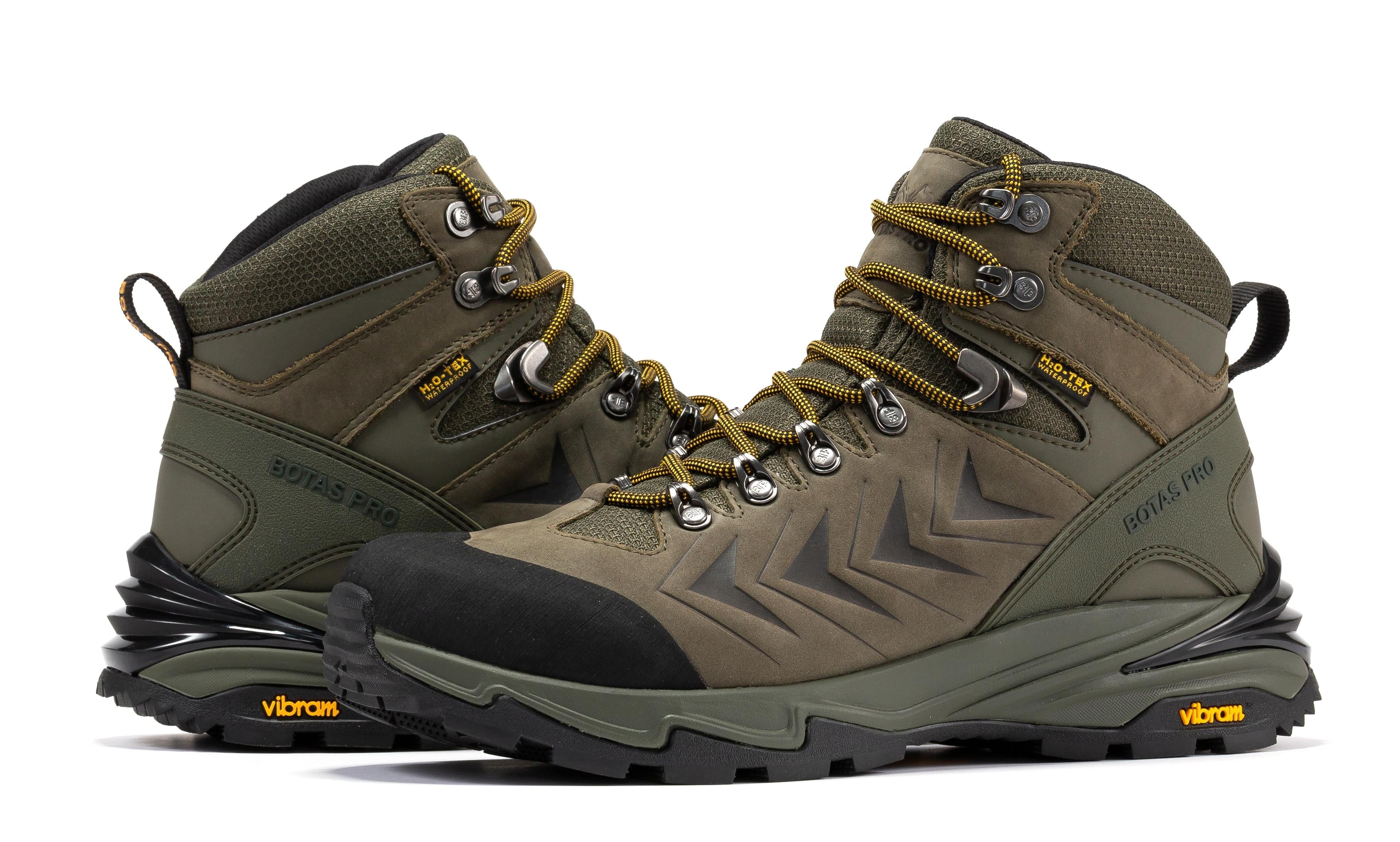 Olive green Rock Rooster Pro 6-inch waterproof hiking boots with Vibram traction lug outsole and sturdy design.