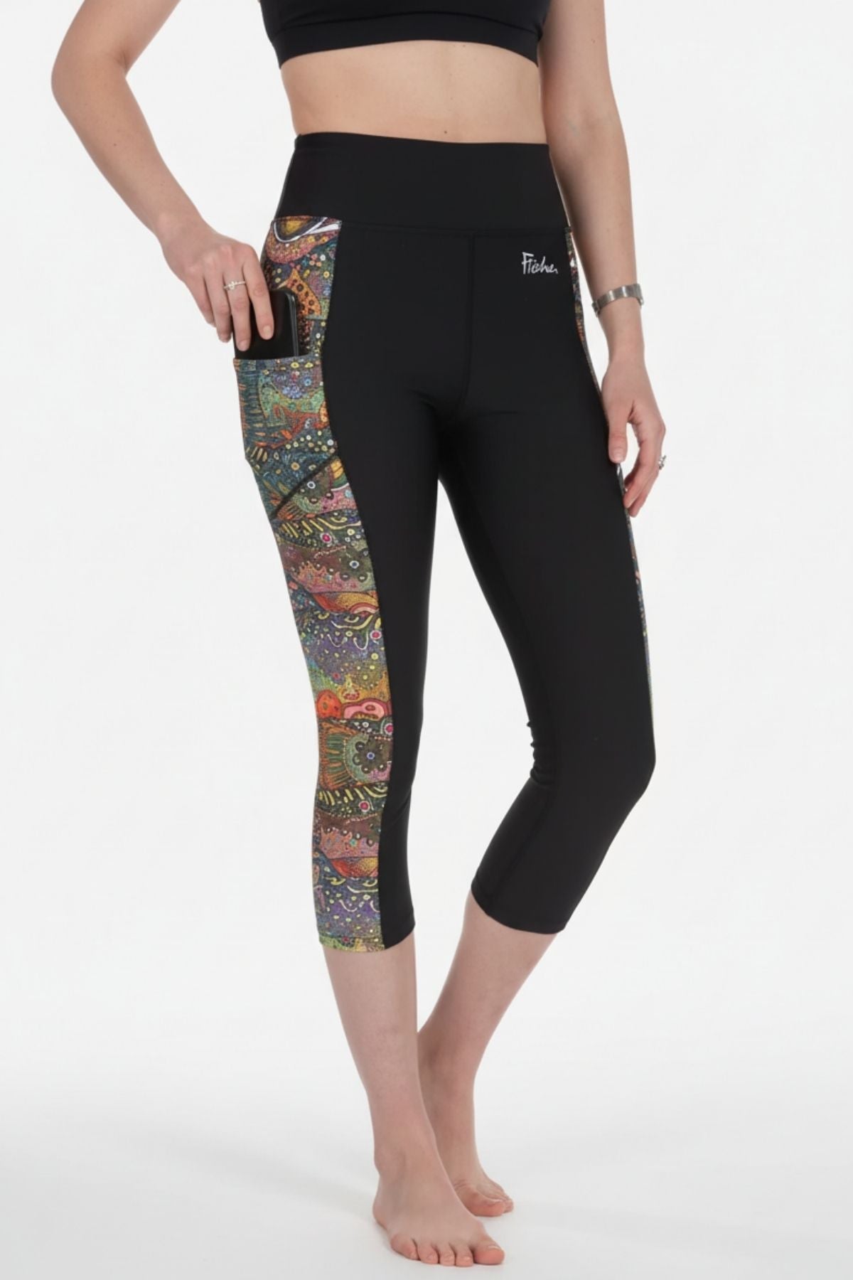 FisheWear Brookie Pocket Capri Leggings shown in black with side pockets and a high-waisted fit, ideal for active wear and casual outings.