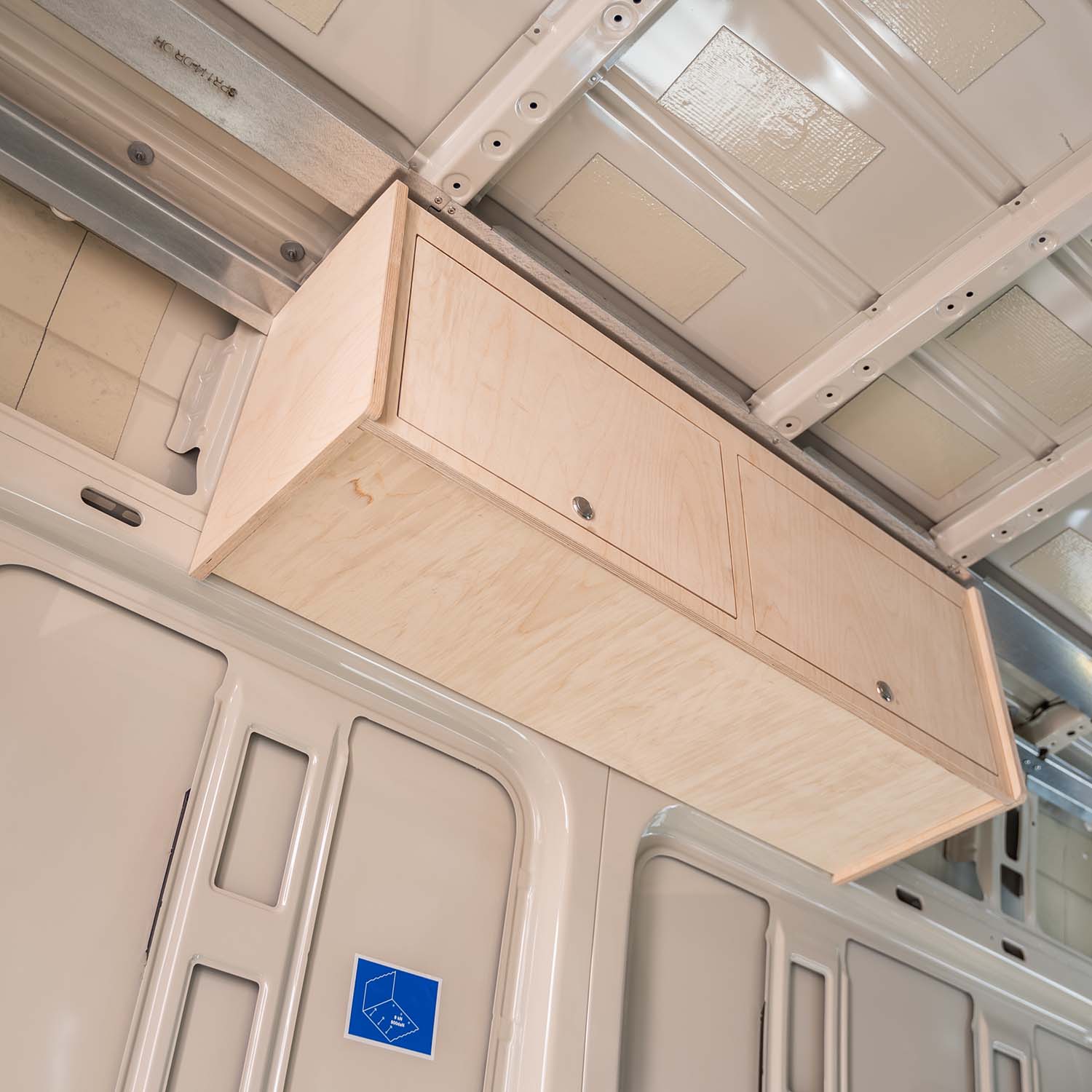 Timber Van Kits overhead cabinet panels for transit van campervan structural assembly, showing sturdy wood construction and mounting details.