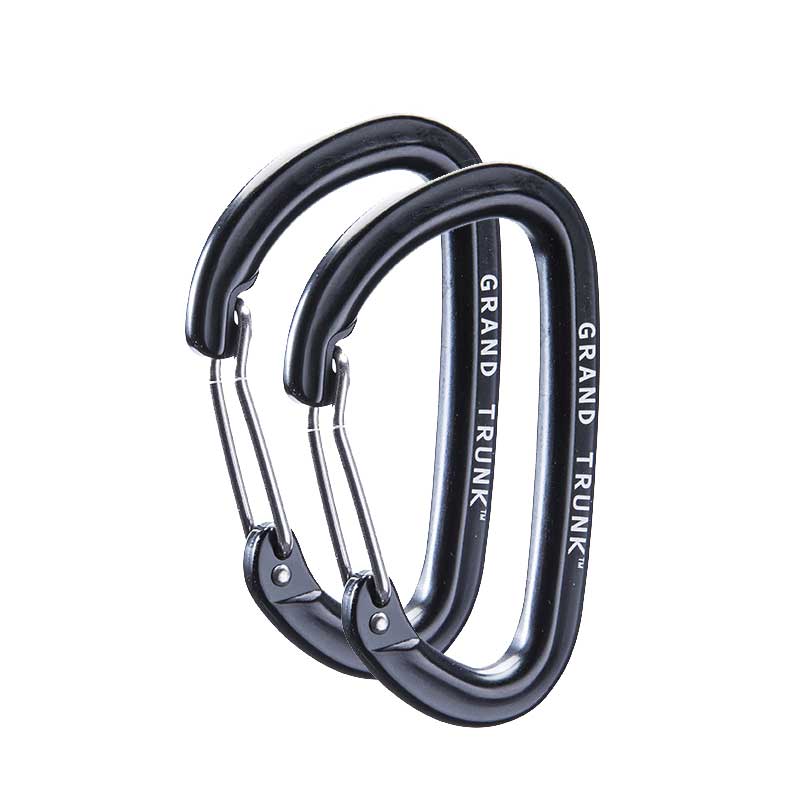 Pair of black aluminum wiregate carabiners, durable accessories from GrandTrunk for climbing, camping, or gear securing.