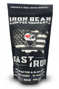 Cast Iron™ medium roast coffee by Iron Bean Coffee Company in a bag showcasing its rich, dark blend and robust aroma.
