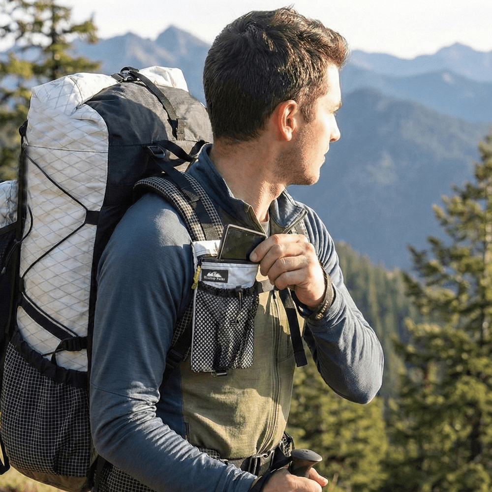 Hilltop Packs cell phone shoulder pouch with zipper and adjustable strap mount, designed for easy carrying and access.
