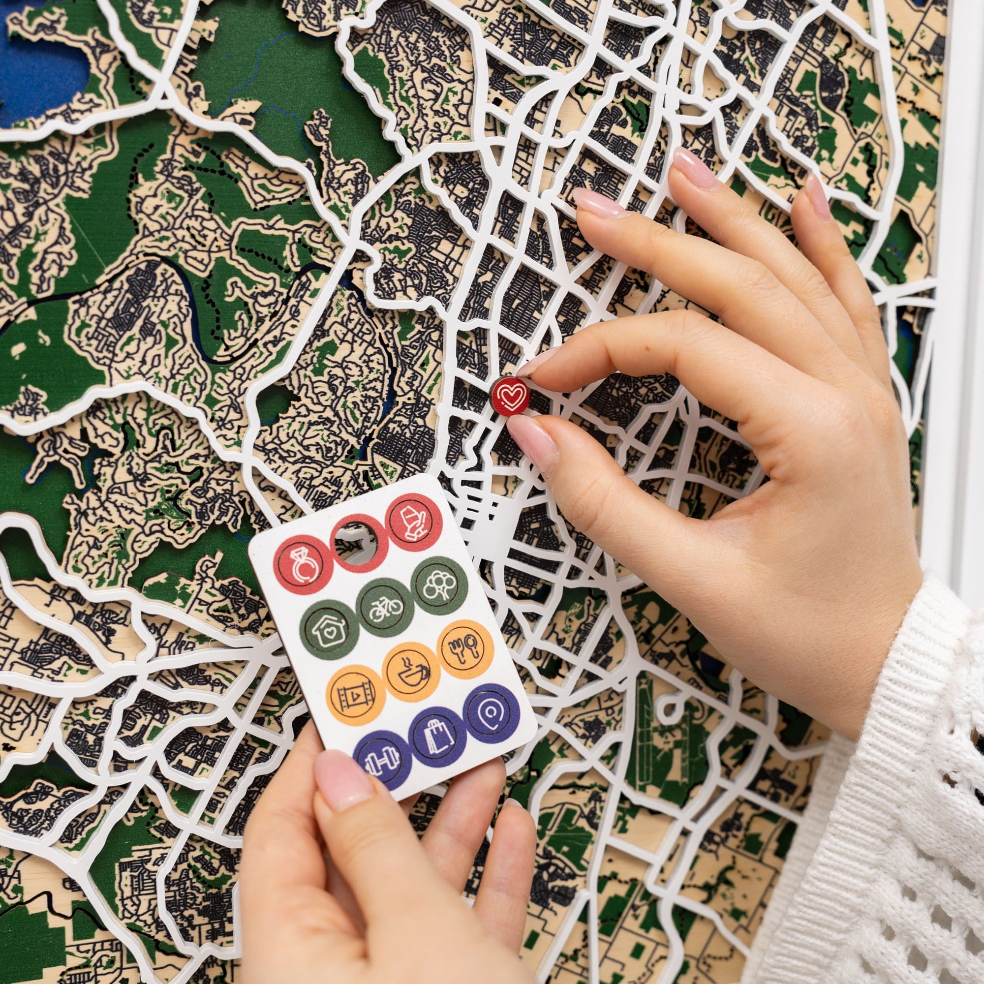 Wooden map pins from Enjoy The Wood, featuring Austin city map design for special event marking and lifestyle icons.