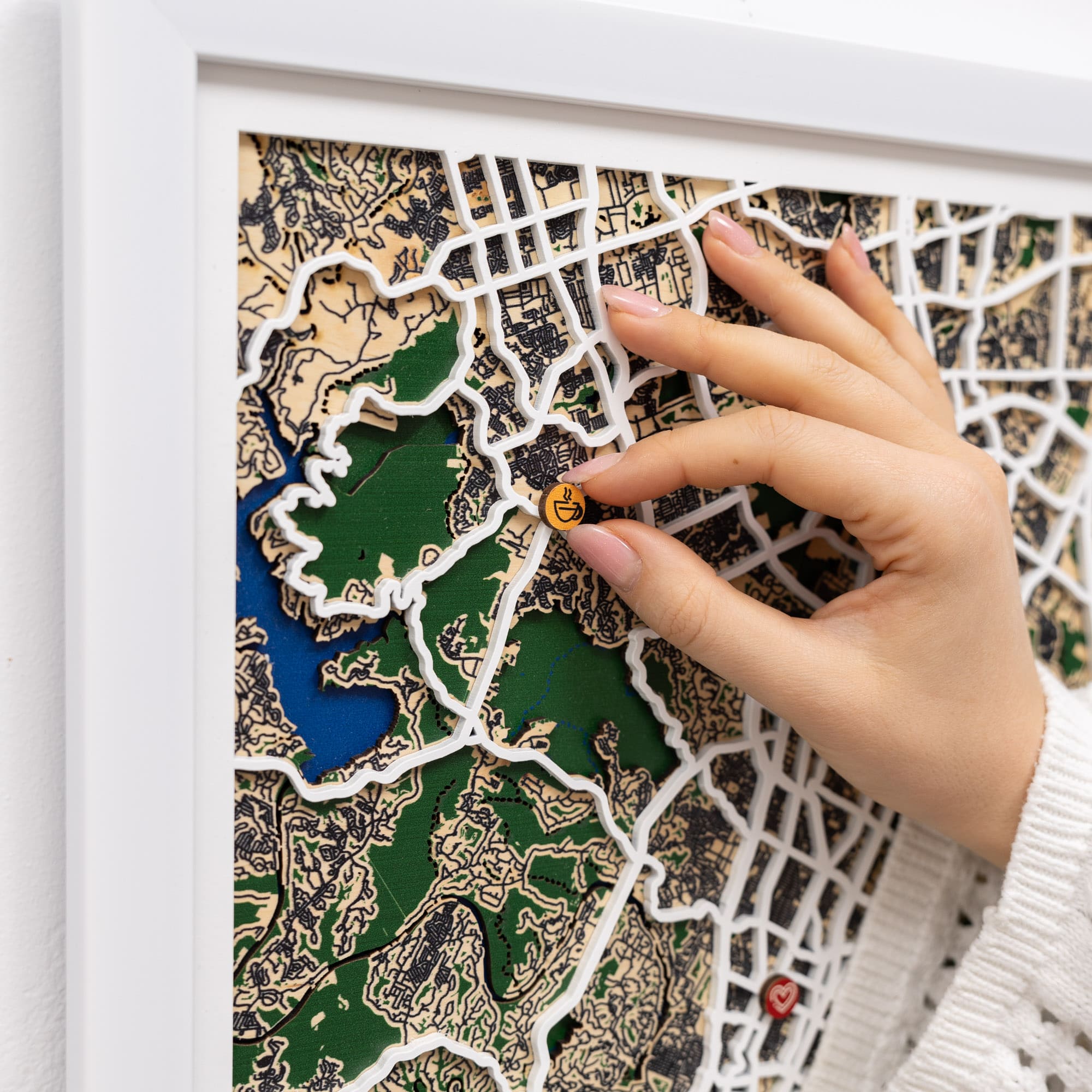 Wooden map pins by Enjoy The Wood marking special event locations on a city map of Austin.
