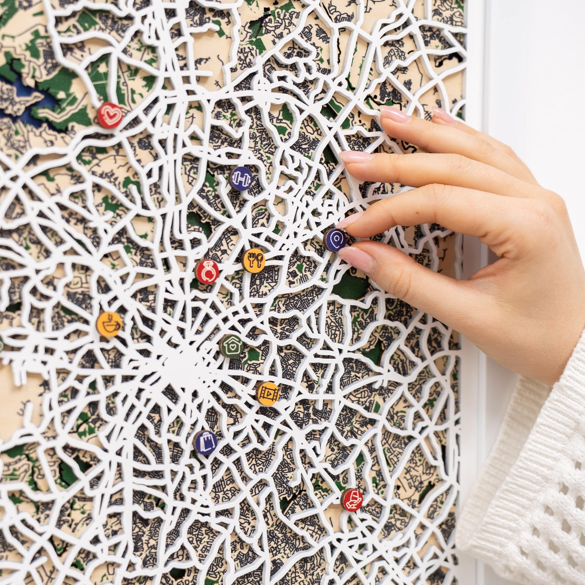 Wooden map pins from Enjoy The Wood, styled as city plan Charlotte icons for special event marking and decor.