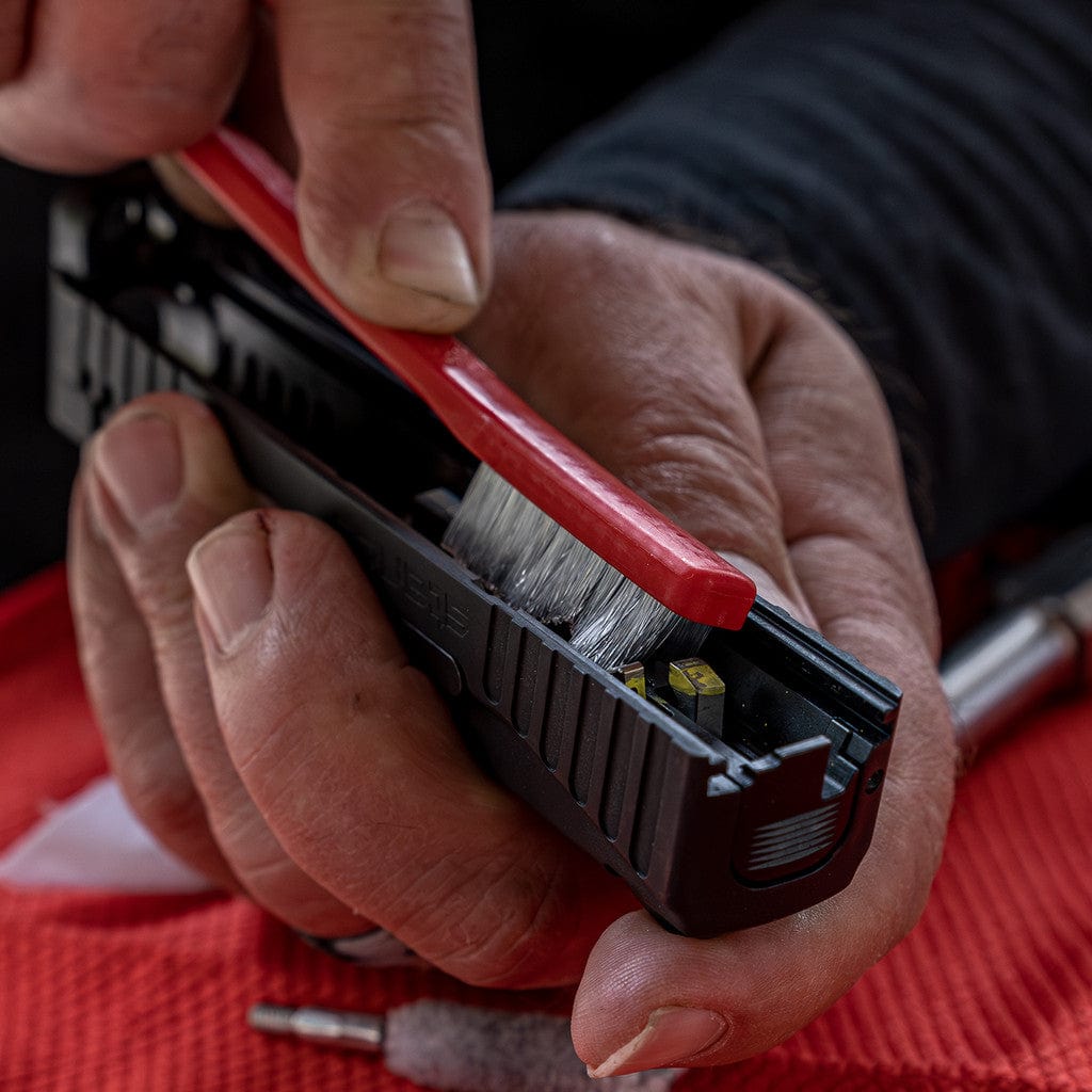 SFT2 Tactical pistol caliber cleaning kit with brushes, rods, and accessories for firearm maintenance.