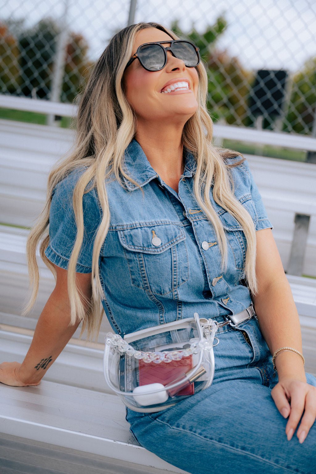 Margo Paige clear belt handbag with adjustable strap, transparent design, and spacious interior, suitable for stylish everyday use.