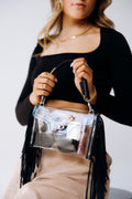 Clear fringe crossbody handbag by Margo Paige with a transparent body and decorative fringe accents.