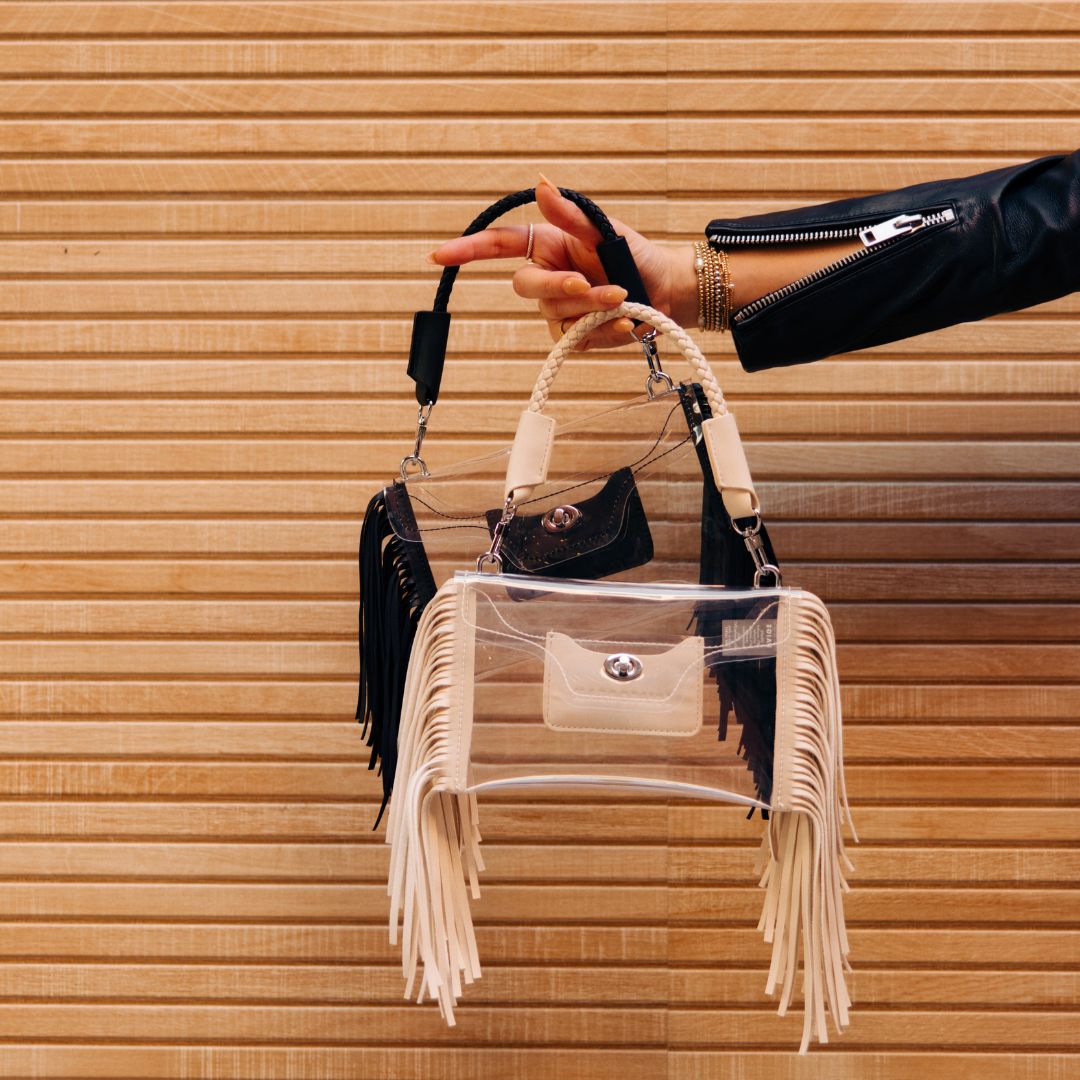 Clear fringe crossbody handbag by Margo Paige with a transparent body and stylish fringe detailing.