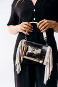 Margo Paige clear fringe crossbody handbag in taupe with tassel accents and adjustable strap, stylish and transparent for everyday use.
