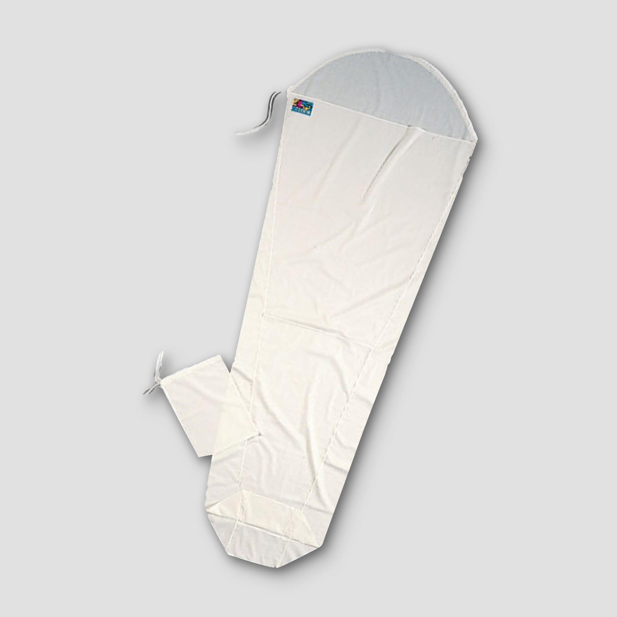 COCOON MummyLiner™ Cotton sleeping bag liner in soft white cotton, showing smooth fabric and compact design.