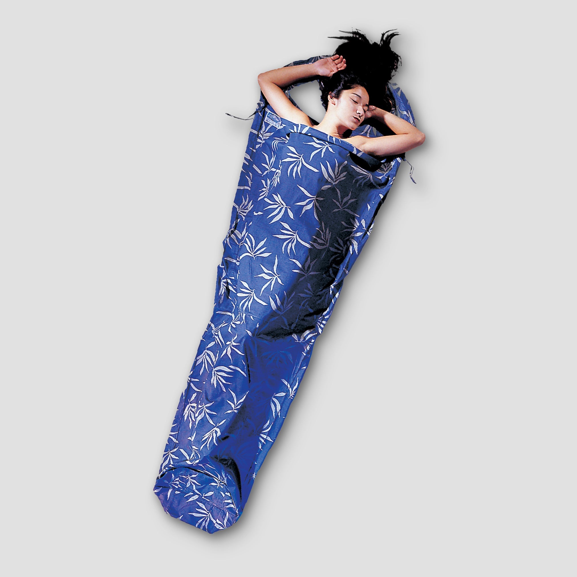 Cotton MummyLiner™ by COCOON, soft and lightweight sleeping liner with a cotton fabric, shown laid flat.