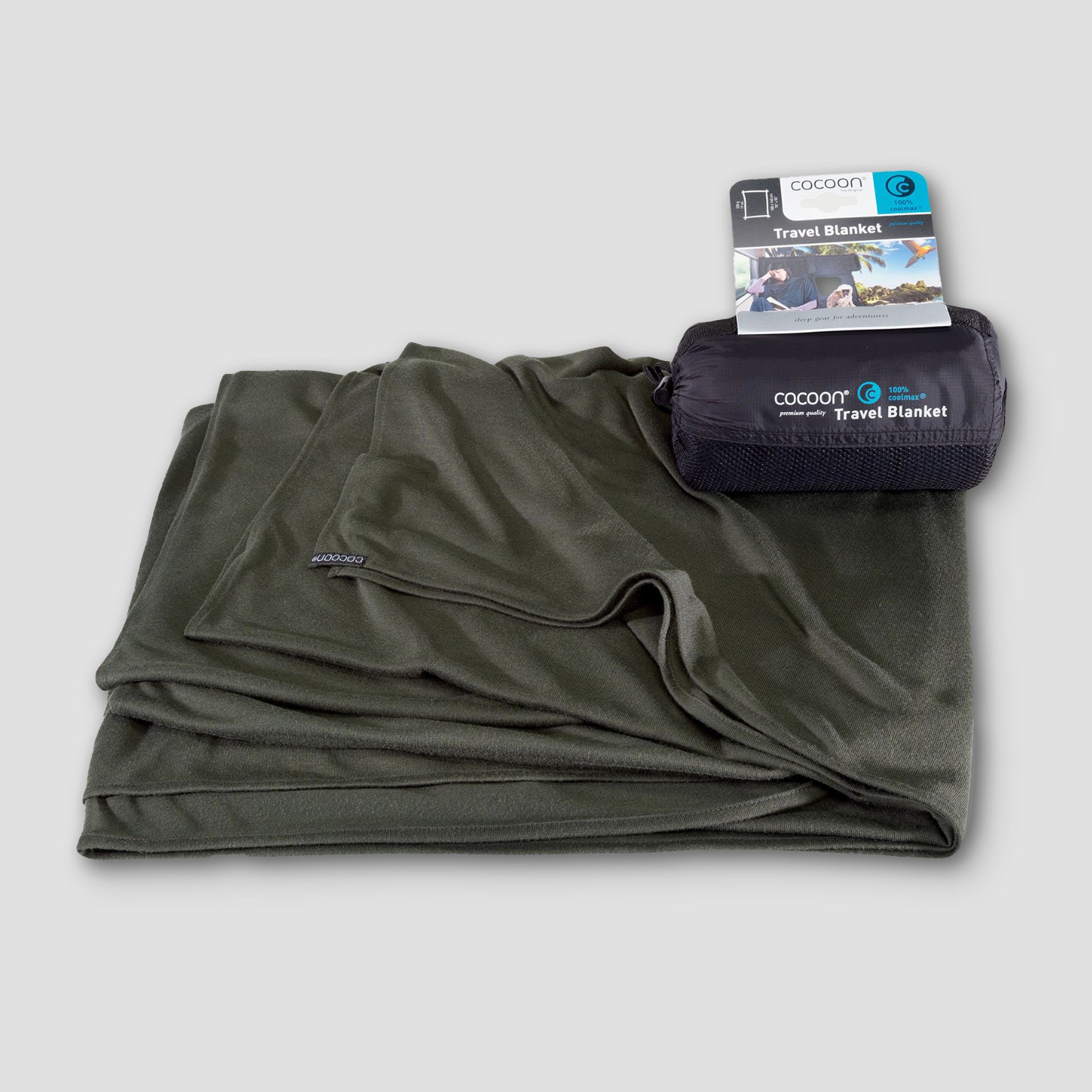 COCOON COOLMAX® travel blanket in soft fabric, ideal for comfort during journeys, displayed folded on a neutral background.