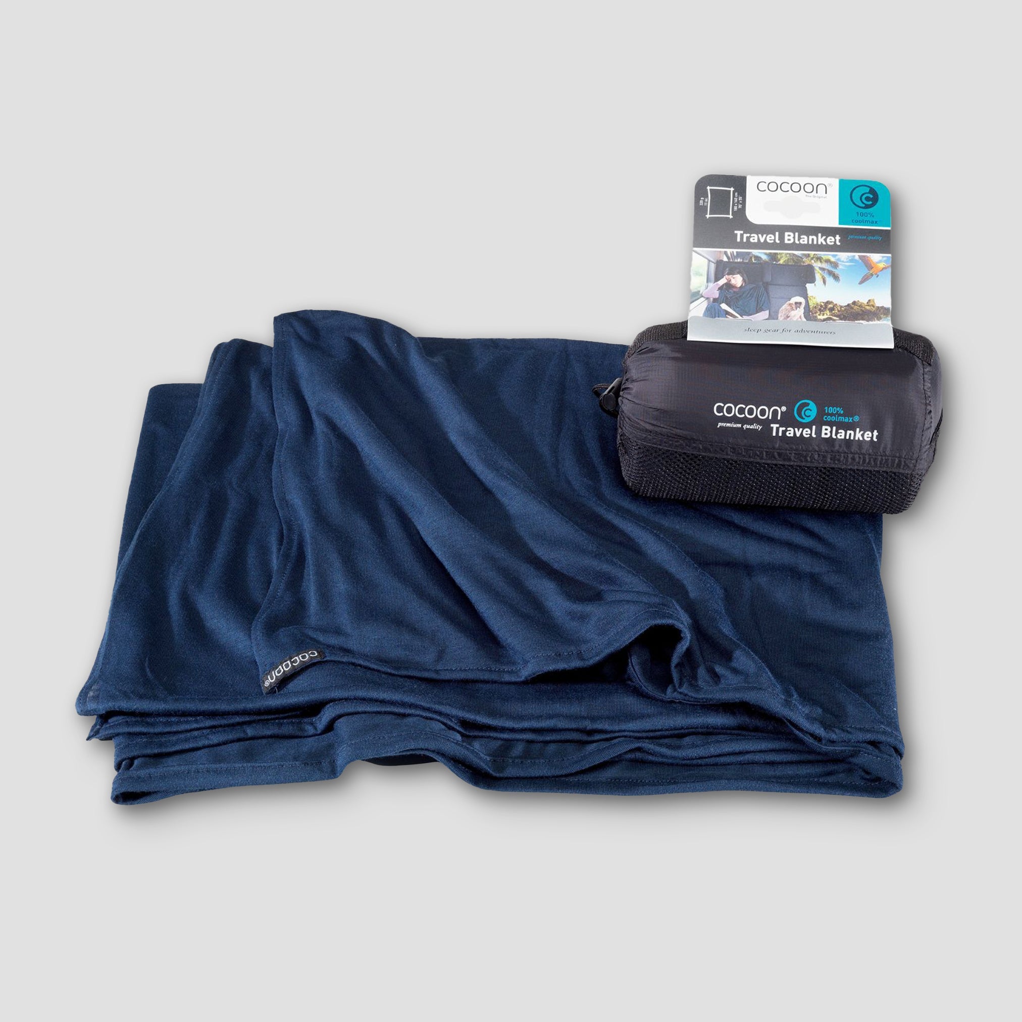 COCOON COOLMAX® travel blanket in folded position, showcasing its compact design and soft texture.