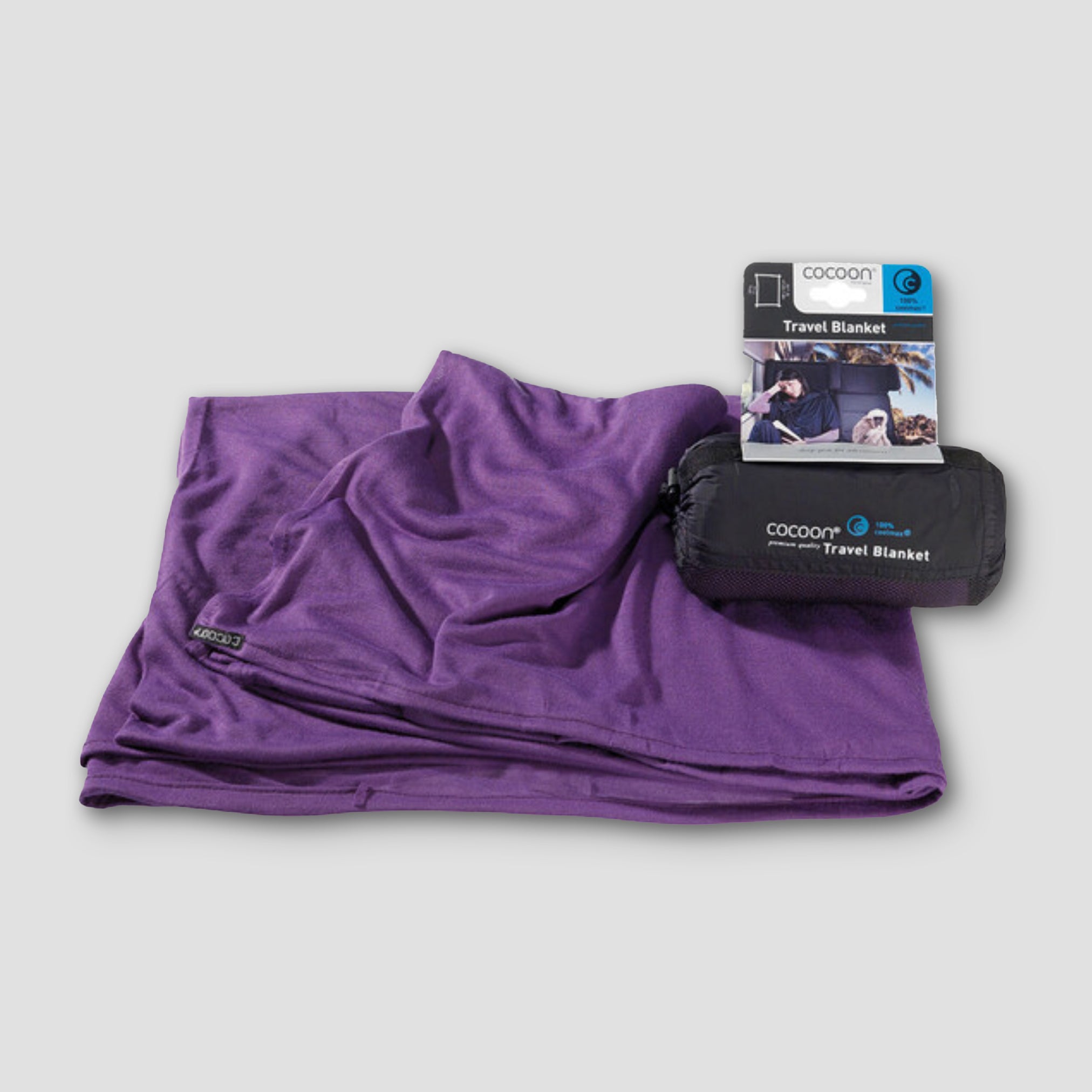 COCOON COOLMAX® travel blanket in a compact design, showcasing its soft texture and lightweight fabric for on-the-go comfort.